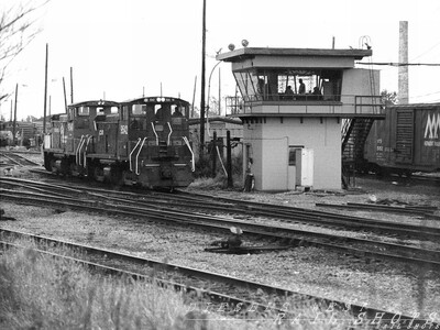 Bailey Avenue Tower Conrail's Frontier Yard
A pair of Conrail SW1500s creep past Bailey Avenue Tower.  An elderly TH&P trio of first generation GMD geeps, the power for this afternoon's BUCP to Toronto, is visible in the upper left.
Photo Copyright 2008 Tim Baldwin
Keywords: bailey;conrail;frontier;yard;th&p