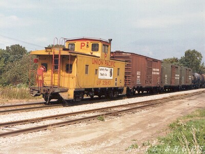 Surprise!
Bringing up the rear of a long N&W merchandise freight, behind a trio of aged M.R.S. boxcars, is well-maintained UP cab #25693 carrying the motto, "Safety Plus, That's Us"
Photo Copyright 2008 Tim Baldwin
Keywords: n&w;merchandise;mrs;up;caboose