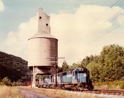 B&M 315 at West Susquehanna PA
An eastbound D&H train led by Boston & Maine #315 passes under the Erie coal tower at West Susquehanna PA, a relic of a much earlier era. The train will proceed east to a connecting track at Lanesboro PA where it will return to home rails via a complicate switchback maneuver at Jefferson Junction, necessitated by the construction work being done at the Belden Hill tunnel site to accommodate double-stack container traffic.  This would be the last hurrah for the old D&H line across Ararat Summit.  
Photo Copyright 2008 Tim Baldwin
Keywords: b&m;d&h;erie;susquehanna;pa;lanesboro;jefferson junction;belden hill;ararat;gp40-2