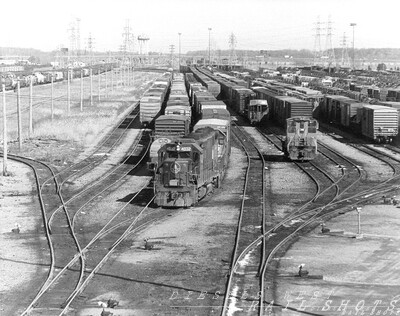 Niagara Yard Niagara Falls NY
A telephoto view of Niagara Yard, as B&O blue GP40-2 #4032 and a sister unit wearing Chessie colors pick up a cut of cars for CG-41's trip across Southern Ontario Province on former Pere Marquette trackage.  A Conrail switcher works at right.  This yard served the Niagara Falls chemical industry as well as GM's Harrison Radiator plant in Lockport.
Photo Copyright 2008 Tim Baldwin
Keywords: c&o;gp40-2;niagara falls;niagara yard;ny;conrail;pere marquette;harrison