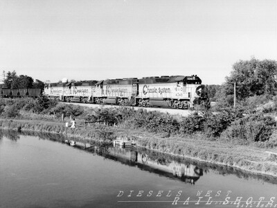 Chessie coal empties - Springville NY
A southbound empty Chessie coal train passes a still pond on now-abandoned B&O trackage through Springville NY.  
In a time-honored tradition, the engineer exchanges waves with a young fisherman.
Photo Copyright 2008 Tim Baldwin
Keywords: springville;ny;chessie;b&o