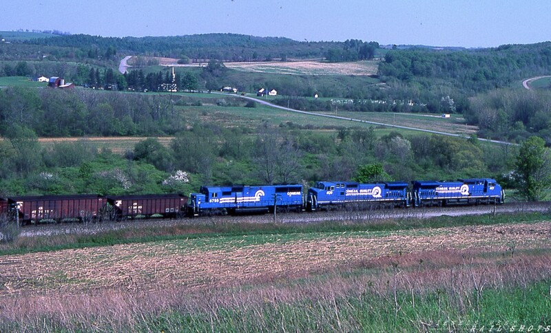 Hill and Dale
A loaded Conrail coal train bound for Johnson City NY passes through scenic Dale NY behind a pair of CW40-8s and a single SD50.  With Attica Hill behind them, the three big locomotives will have no trouble maintaining track speed as they make their way east on the ex-EL Southern Tier Line.
Photo Copyright © 2008 Tim Baldwin
Keywords: conrail;coal;johnson city;ny;dale;cw40-8;sd50;southern tier;attica hill