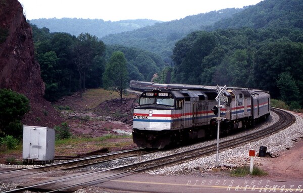 Amtrak's Capitol Limited Fairhope PA
The eastbound Capitol Limited, led by Amtrak F40PH #377, winds its way around the 'S' curve at Fairhope PA as it eases its way down Sandpatch Grade on a hazy summer morning.
Photo Copyright 2008 Tim Baldwin
Keywords: f40ph;amtrak;377;capitol;limited;pa;sandpatch;fairhope