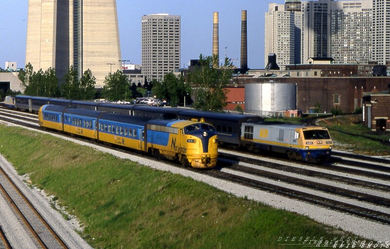 Two trains passing in the light
By a fortunate coincidence, an eastbound VIA LRC set headed into Toronto's Union Station passes behind Ontario Northland's outbound Northlander, led by FP7 #1987.  The warm late afternoon light brings out the richness of the Northlander's ex-TEE trainset's colours.
Photo Copyright 2008 Tim Baldwin
Keywords: via;lrc;toronto;union station;northlander;fp7;1987