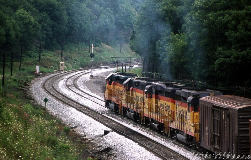 High Green on Sandpatch
Clouds of blue diesel exhaust testify to the effort involved in moving tonnage up Sandpatch grade.  A mixed quartet of second generation geeps, representing all three Chessie System component roads, shatters the morning stillness of nearby Meyersdale PA as they struggle relentlessly toward the summit.  The Clear signal indication is certainly a welcome sight to the crew.
Photo Copyright 2008 Tim Baldwin
Keywords: salisbury;chessie;geeps;sandpatch;maryland;signal