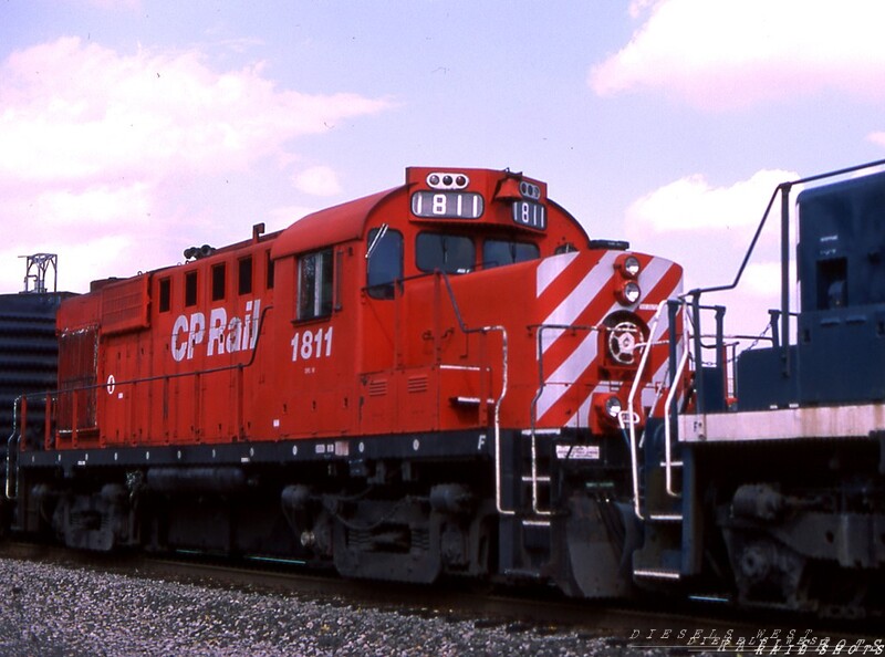 CP Rail MLW RS18u #1811 Silver Springs NY
Tucked away behind two PLM SD40s and lead SD40-2 CP Rail #5678 on this day is MLW class of 1958 member #1811, rebuilt by CP in 1981 to class RS18u.  D&H train BUEB has stopped to pick up a string of loaded salt hoppers at the Morton Salt plant in Silver Springs NY.
Photo Copyright © 2008 Tim Baldwin
Keywords: cpr;silver springs;rs18u;plm;mlw;1811