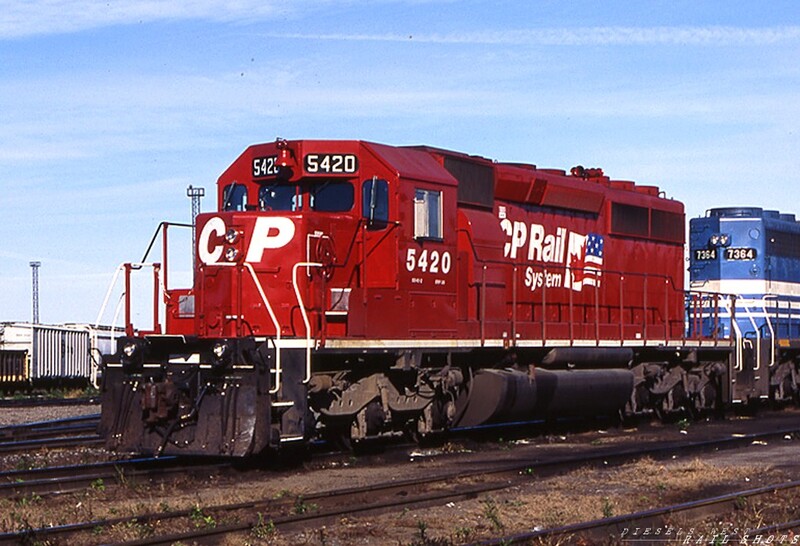 CP Rail SD40-2 #5420 SK Yard Buffalo NY
CP Rail SD40-2 #5420, clad in fresh 'dual flag' livery, awaits a call to action at SK Yard in Buffalo NY, accompanied by leased GATX SD40-2 #7364. Photo Copyright © 2008 Tim Baldwin
Keywords: sd40-2;sk yard;buffalo;ny;gatx;dual flag