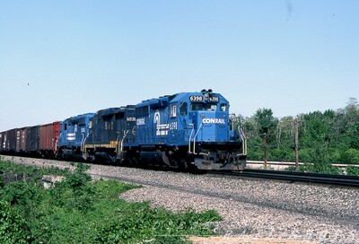 a pleasant surprise
An unexpected B&O GP30 in classic blue paint is bracketed by a pair of ubiquitous Conrail SD40-2s, with CR #6398 in the lead as the westbound nears the PA-OH state line.
Photo Copyright 2008 Tim Baldwin
Keywords: b&o;gp30;conrail;pa;oh