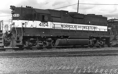 N&W GP38-2 #4104
Wearing a rare paint scheme, N&W (ex-Southern) GP38-2 #4104 is seen in the consist of a transfer run at D&H's SK Yard in Buffalo in the early days of the Norfolk Southern merger.
Photo Copyright 2008 Tim Baldwin
Keywords: n&w;southern;gp38-2;buffalo