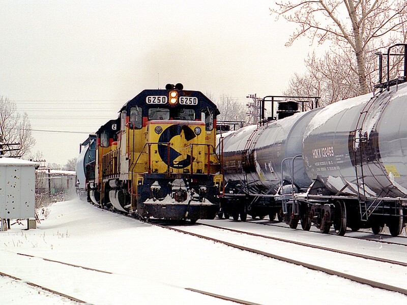 CSX GP40-2 #6250 CP EL-3 Tonawanda NY
As Toronto to Buffalo freight CPBU heads east along the Niagara Branch en route to Conrail's Frontier Yard, Westbound CSX freight CG-41 arrives at CP EL-3 on its way to Niagara Yard near Suspension Bridge in Niagara Falls. The diverging track in the foreground is the former Lehigh Valley connecting track, which now serves as an industrial spur.
Photo Copyright 2008 Tim Baldwin
Keywords: gp40-2;csx;cp;el-3;tonawanda;toronto;buffalo;freight;niagara;cg-41;bridge;suspension;lehigh