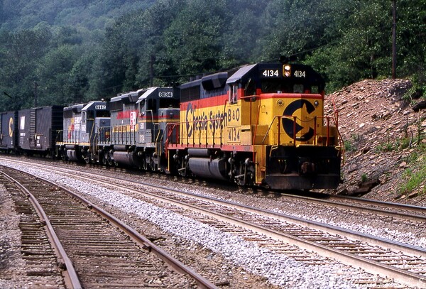 CSX freight Keystone PA
An Eastbound CSX freight led by B&O GP40-2 #4134 climbs Sandpatch grade at Keystone PA. The 'elephant style' locomotive consist also includes SBD SD40-2 #8134 in Family Lines livery as well as GP40 #6662 in Seaboard System paint.
Photo Copyright 2008 Tim Baldwin
Keywords: csx;family;seaboard;chessie;b&o;gp40-2;sandpatch;keystone;pa;sd40-2