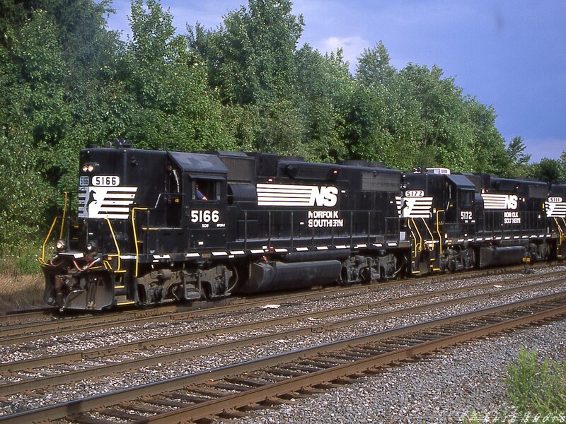 NS GP38-2 #5166 Silver Springs NY
A trio of ex-SOU GP38-2s pick up loaded salt hoppers from the Morton Salt plant at Silver Springs NY on the ex-CR Southern Tier Line.  After assembling their train, NS HOG will return to Bison Yard in Buffalo.
Photo Copyright 2008 Tim Baldwin
Keywords: gp38-2;ns;silver springs;sou;morton salt;cr;bison yard