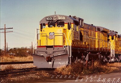 MP C36-7 #9031 Erie PA
Brand new MoPac C36-7 #9031 in UP Armour Yellow basks in the late afternoon sun on the NS setout track at GE's Erie plant.  The colors are brilliant, but I do miss the eagle and that rich MoPac blue.
Photo Copyright 2008 Tim Baldwin
Keywords: mopac;c36-7;erie plant;erie;pa