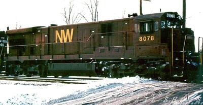 N&W C30-7 #8078
Just prior to the NS merger, N&W painted a few units in their maroon and gold passenger colors.  C30-7 #8078 brightens an otherwise dismal day on the Southern Tier Line at Marilla NY.
Photo Copyright 2008 Tim Baldwin
Keywords: n&w;c30-7;marilla;ny