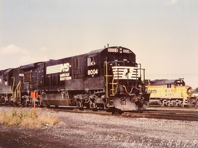 NS C30-7 #8004 SK Yard Buffalo NY
NS C30-7 #8004 awaits permission to enter D&H's SK Yard in Buffalo NY with an incoming freight.  In the background, B&amp;O GP40-2 #4151 waits on the Bison Runner with an eastbound Sea-Land intermodal train.  NYS&W was the designated operator of the D&H during this time frame, and every railfan trip to the yard brought pleasant surprises.
Photo Copyright 2008 Tim Baldwin
Keywords: ns;c30-7;d&h;sk yard;sea-land;nys&w