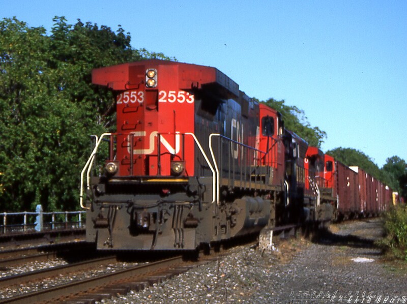 Hammerhead in uncharted territory
A CN movement from Frontier Yard west along the Belt Line to Fort Erie Canada is led by D9-44CW #2553 running long hood forward as it passes Milepost 5.  With permission from the CSX NG Dispatcher, the crew would turn the power at CP&I before proceeding across the International RR Bridge to home rails.
Photo Copyright © 2008 Tim Baldwin
Keywords: d9-44cw;2552;cn;frontier yard;erie;csx;international;bridge