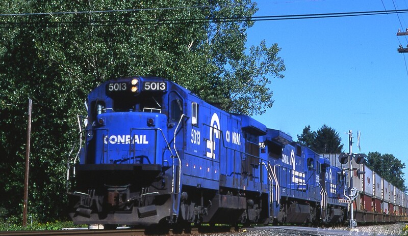 CR B36-7 #5013 Erie St Lancaster NY
Hot Conrail American President Line doublestack train TV-501 roars through suburban Lancaster NY behind C36-7 #5013, a B40-8, and a sister unit as they near the Buffalo end of the ex-EL Southern Tier Line.  At Buffalo, the train will head west on the former NYC Water Level Route.
Photo Copyright © 2008 Tim Baldwin
Keywords: b36-7;erie;lancaster;ny;apl;doublestack;buffalo;water level