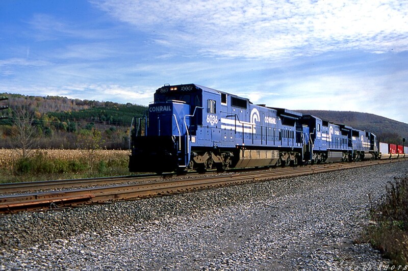 A face only a railfan could love
A pair of ungainly looking C40-8s, with CR #6036 as the leader and an EMD SD50 as the third unit, race through rural Dalton NY with TV-501.  The train is westbound, en route to Buffalo NY where it will access Conrail's ex-NYC Water Level Route mainline.
Photo Copyright © 2008 Tim Baldwin
Keywords: conrail;cr;c40-8;nyc;dalton;ny