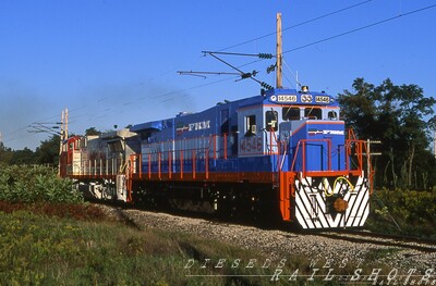 FNM C36-7 #14546 on the EEC test track
The late afternoon sun accentuates the red-orange handrails on "super seven" FNM C36-7 #14546, heading west on the East Erie Commercial test track near GE's Erie PA facility accompanied by a wide cab Santa FE 8-40BW.
Photo Copyright 2008 Tim Baldwin
Keywords: fnm;c36-7;test track;erie;pa;santa fe;8-40bw