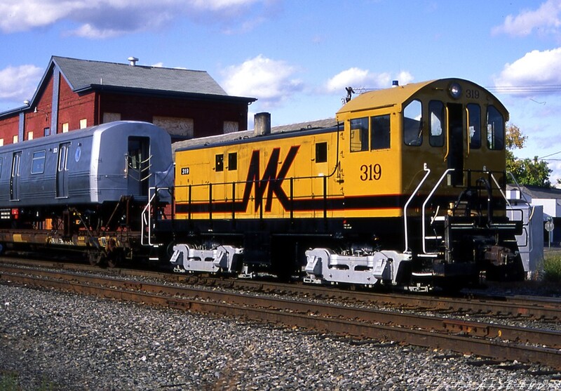 MK Alco S6 #319 Hornell NY
Morrison-Knudsen's Alco S6 shop switcher sets out a pickup of refurbished commuter rail cars for Conrail's BUOI.  The ex-EL Hornell station is in the background.
Photo Copyright 2008 Tim Baldwin
Keywords: mk;s6;319;hornell