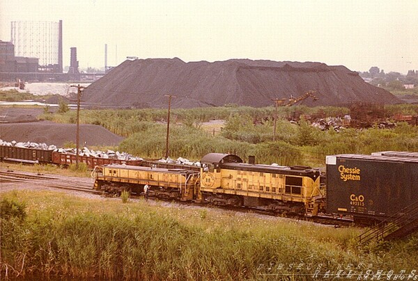 South Buffalo RR Tifft St Buffalo NY
A South Buffalo RR Alco S2(#88) switcher/slug combination handles a cut of auto parts boxcars for the Ford stamping plant in Woodlawn, as seen from the Tifft St overpass.
Photo Copyright 2008 Tim Baldwin
Keywords: buffalo;ny;tifft;switcher;slug;woodlawn;ford;auto;s2;88