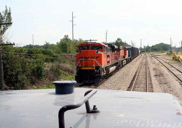 Meeting the D910 at McGrew
While I was waiting for signal at McGrew, the D910 pulls up to a redboard, waiting to get into the yard.  This BNSF power was the same power that I used on a coal train the previous day
Keywords: d910;mcgrew;redboard;bnsf;lsrc;5921;cab