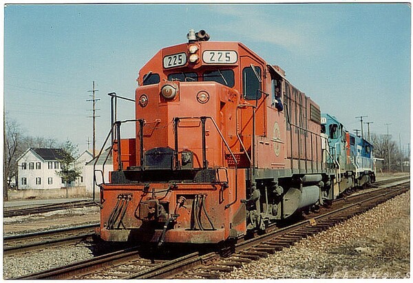 GTW Train 393
Shortly after the merger in 1982 of the GTW and the DT&I, train 393, led by #225(GP38-2) stops in Lapeer, MI, to make an unscheduled pick-up
Keywords: gtw;dt&i;lapeer;mi;gp38-2