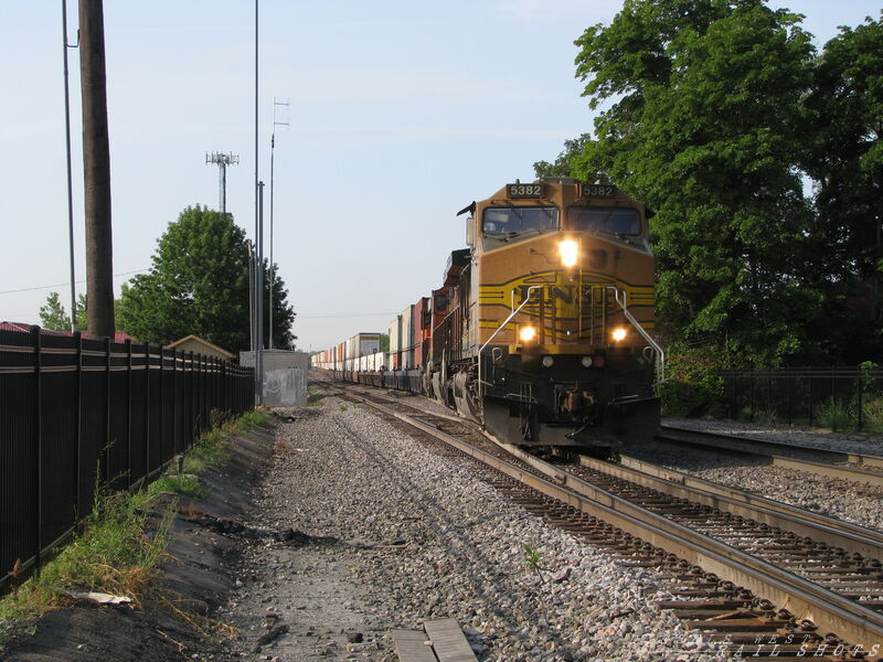 BNSF EB Double Stack
BNSF 5382, 4507 and 7014 on an eastbound domestic stack train at MP 26.10 on the TransCon in Olathe, Kansas on 7/31/2014. Train is headed through the crossovers to change from Mainline 1 to Mainline 2. In 26 more miles the train will be entering the old ATSF Argentine Yard in Kansas City.
Keywords: bnsf;double;stack;53;domestic;kansas;transcon;crossover