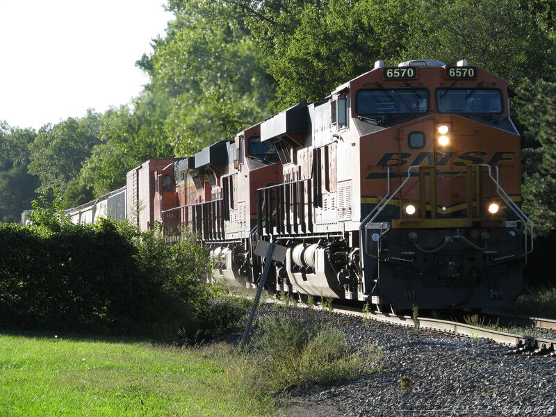 BNSF SB General Merchandise
BNSF 6570, 6656(ES44C4's) and 749(D9-44CW) lead a string of general merchandise across Olathe, Kansas on 9/21/2014. This train is leaving the TransCon to join the south bound tracks formerly owned by the Frisco and MKT which runs south through Kansas and on to Texas. This is a connector line that was rebuilt by BNSF soon after the merger with the ATSF to allow trains originating in the old ATSF yard in Kansas City to join the old Frisco line running south out of Kansas City.
Keywords: d9-44cw;es44c4;bnsf;merchandise;transcon;frisco;mkt;kansas;olathe