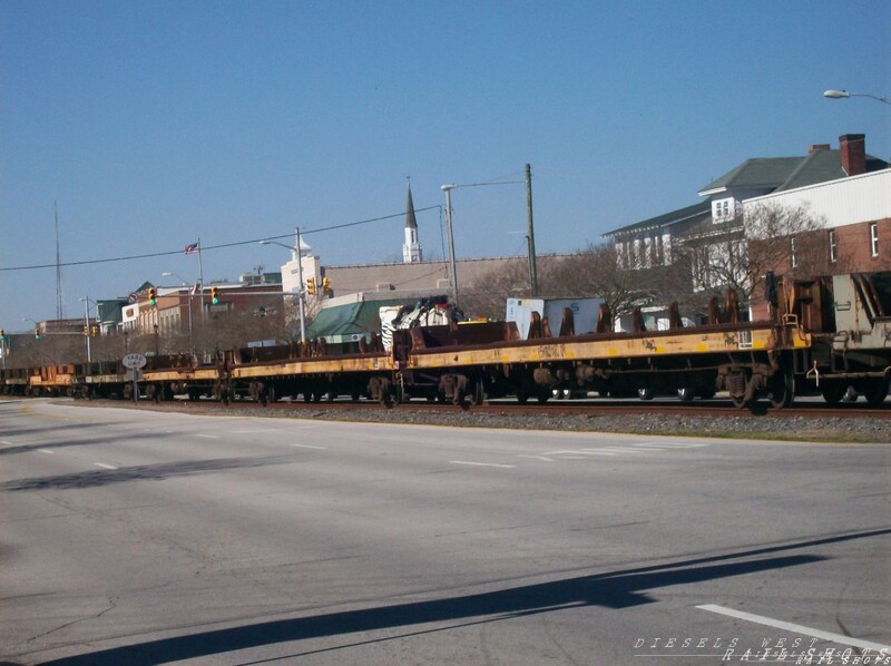 Norfolk Southern'street running' 
Norfolk Southern freight 
Street running into 'City Port'
Keywords: ns;morehead;street;flats;flat car;city port