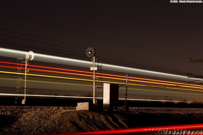 Hughson Sunday Nights
The peacefulness of Hughson, California is shattered for less than 40 second while a northbound Amtrak California San Joaquin train 718. CDTX 2051, whose earned the nickname 'Sluggo', on account of its slow loading times, is pulling this trainset at a brisk 79mph rushing northward to Oakland at the other end of this corridor. 
Present here are two ghosts from the past. Two old Santa Fe Searchlight signals guard this train and grants it safe passage from one signal block to another. These signals are becoming few and far in between as the BNSF Railway is replacing them with modern 'Tri-Lights'. 
Santa Fe Avenue parallels its namesake railroad from Escalon to Madera and is one of the many rout
Keywords: hughson;amtrak;san joaquin;b32-8hw;night