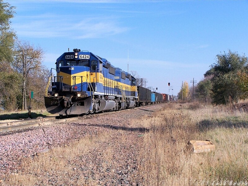 Davis Junction
Crossing over the Illinois Railway (ex MILW) and running on home rails (EX MILW) this westbound ICE train heads thru Davis Junction, Illinois enroute to Savanna, Illinois on a beautiful fall afternoon - #6424 SD40-2
Keywords: sd40-2;davis;illinois;diamond;milw;ice;savanna