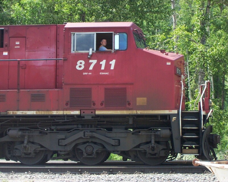 Perspective on CP ES44AC #8711
Often, train photos are taken from a distance in order to capture a good portion of the train and the surrounding scenery. I do that, too. But, on this occasion, I grabbed this photo as #8711 slowly rolled by on it's way to one of the four coal mines north of our locale. When I look at how puny the engineer appears to be in relationship to the size of the locomotive, I am awestruck by the majesty of these giant machines! I took this photo near the Track Supervisor's office in Sparwood, British Columbia, Canada
Keywords: cp;es44ac;8711;sparwood;bc;british columbia