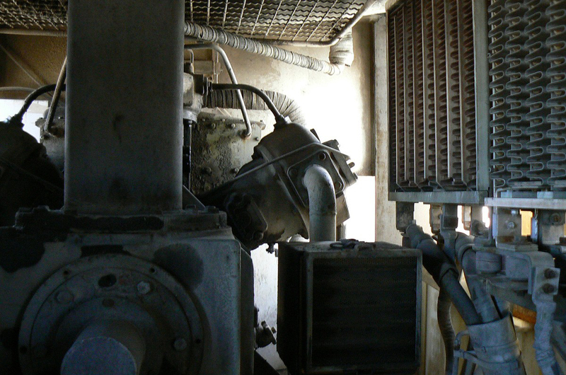 Rear interior of U30C
Here's a shot looking from the sandbox, at the rear of the locomotive. It shows the bottom of the radiator fan, the air compressor, and the dynamic brake grids.
Keywords: interior;radiator;dynamic;brake;grids;compressor;pueblo;u30c