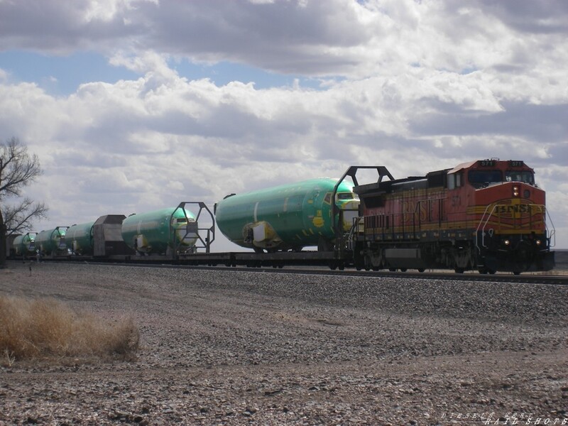 BNSF Boeing transport 89' flats
This is a common sight along the BNSF Powder River Sub. These flat cars are specially outfitted to transport partially assembled jet fuselages up into Washington state to be finished. April, 2008
Keywords: boeing;fuselage;washington;powder river;airplane